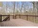 Spacious deck overlooking a wooded backyard at 8801 Traders Lndg, Brownsburg, IN 46112
