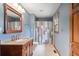 Clean bathroom, featuring granite countertop, updated vanity, and a shower/tub combo at 8801 Traders Lndg, Brownsburg, IN 46112