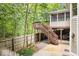 Elevated deck with stairs and screened porch at 8801 Traders Lndg, Brownsburg, IN 46112