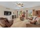 Relaxing living room with hardwood floors, comfortable seating, and large windows at 4739 Beechwood Rd, Avon, IN 46123
