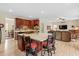 Eat-in kitchen with island, hardwood floors, and access to Gathering room at 4739 Beechwood Rd, Avon, IN 46123
