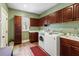 Laundry room with washer, dryer, and ample storage at 4739 Beechwood Rd, Avon, IN 46123