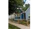 Newly renovated blue house with a wooden fence and small front yard at 221 Kansas St, Indianapolis, IN 46225