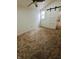 Charming attic bedroom with carpet, barn door, and window at 221 Kansas St, Indianapolis, IN 46225