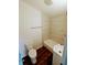 Updated bathroom with tile shower/tub and wood-look floors at 221 Kansas St, Indianapolis, IN 46225