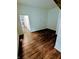 Empty bedroom with hardwood floors and view into kitchen at 221 Kansas St, Indianapolis, IN 46225