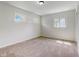 Bright bedroom with neutral walls, carpeting, and multiple windows at 4012 Sawyer St, Indianapolis, IN 46226