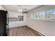 Bright kitchen with white cabinets and wood floors at 4012 Sawyer St, Indianapolis, IN 46226