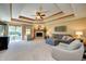 Spacious living room featuring a fireplace, sliding glass doors, and a coffered ceiling at 19 Torrey Pine Dr, Brownsburg, IN 46112