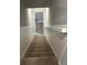 Carpeted stairs leading down to the basement at 863 E Harrison St, Martinsville, IN 46151