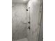 Walk-in shower with marble tile and glass shelving at 863 E Harrison St, Martinsville, IN 46151