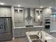 Modern kitchen with grey cabinets and granite countertops at 863 E Harrison St, Martinsville, IN 46151