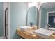 Modern bathroom with double vanity and arched mirrors at 4237 Foxglove Trce, Indianapolis, IN 46237