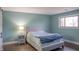 Cozy bedroom featuring a gray platform bed and a light lamp at 4237 Foxglove Trce, Indianapolis, IN 46237