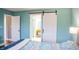 Bedroom with white barn door leading to en-suite bathroom at 4237 Foxglove Trce, Indianapolis, IN 46237