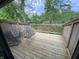 Private deck with wooded views and outdoor seating at 4237 Foxglove Trce, Indianapolis, IN 46237