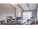 Spacious living room with a fireplace and access to a deck at 4237 Foxglove Trce, Indianapolis, IN 46237