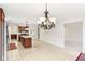 Kitchen with island, chandelier, and views into dining area at 7488 River Highlands Dr, Fishers, IN 46038