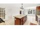 Kitchen boasts a large granite island and ample cabinet space at 7488 River Highlands Dr, Fishers, IN 46038