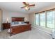 Large main bedroom with a king-size bed, ample natural light, and carpet flooring at 10706 Augusta Blvd, Fishers, IN 46037