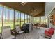 Relaxing screened porch with patio furniture and a grill at 10706 Augusta Blvd, Fishers, IN 46037