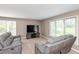 Gathering room with two gray sofas and large TV at 10706 Augusta Blvd, Fishers, IN 46037