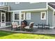Cozy patio with seating area and grill, adjacent to house at 10706 Augusta Blvd, Fishers, IN 46037