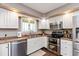 Kitchen with stainless steel appliances and white cabinets at 10706 Augusta Blvd, Fishers, IN 46037
