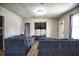Spacious living room with comfortable couches and large TV at 4014 E 10Th St, Indianapolis, IN 46201