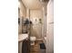Clean bathroom with a toilet, sink, and shower/tub combo at 4014 E 10Th St, Indianapolis, IN 46201