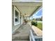 Quaint front porch with seating, perfect for relaxing at 4014 E 10Th St, Indianapolis, IN 46201