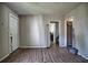 Spacious living room with hardwood floors and access to other rooms at 4014 E 10Th St, Indianapolis, IN 46201