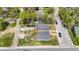 Two new gray houses, viewed from above, showing yards and street at 3002 N Olney St, Indianapolis, IN 46218