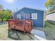 Newly built blue house with wooden deck and walkway at 3002 N Olney St, Indianapolis, IN 46218