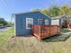 Newly built blue house with wood deck and porch at 3002 N Olney St, Indianapolis, IN 46218