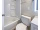 Simple bathroom with white toilet and shower/tub combo at 3002 N Olney St, Indianapolis, IN 46218