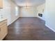 Bright living room featuring dark tile floors, recessed fireplace, and chandelier at 3002 N Olney St, Indianapolis, IN 46218