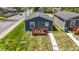 Newly built blue house with wood deck and walkway at 3002 N Olney St, Indianapolis, IN 46218