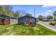 Gray house with wooden deck and patio furniture, side view at 3002 N Olney St, Indianapolis, IN 46218