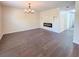 Spacious living area showcasing dark hardwood floors and a fireplace at 3002 N Olney St, Indianapolis, IN 46218