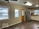 Kitchen area with stainless steel refrigerator and wood flooring at , Lebanon, IN 46052