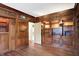 Unique library with wood paneling, built-in shelving, and hardwood floors at 1311 Golden Hill Dr, Indianapolis, IN 46208