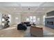 Spacious living room with hardwood floors, a fireplace, and large windows at 421 S Randolph St, Indianapolis, IN 46201