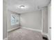 Simple bedroom with neutral walls and carpet at 332 Northern Ave, Indianapolis, IN 46208