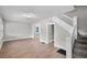 Spacious living room with hardwood floors and staircase at 332 Northern Ave, Indianapolis, IN 46208