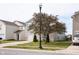 Two-story house with gray siding, brick accents, and a two-car garage at 8628 Hosta Way, Camby, IN 46113