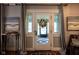 Bright entryway with white door and stained glass at 675 Woodruff Place West Dr, Indianapolis, IN 46201