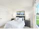 Charming bedroom with large windows, plush bedding, and dark gray nightstands at 6941 E Bean Blossom Dr, Camby, IN 46113