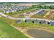 Community overview with homes and pond at 6941 E Bean Blossom Dr, Camby, IN 46113
