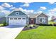 Blue and gray house with stone accents and a two-car garage at 6941 E Bean Blossom Dr, Camby, IN 46113